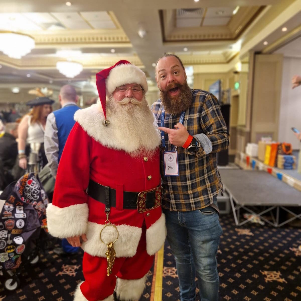 Blake Mayer dressed as Santa at the RUNESILK trade stand
